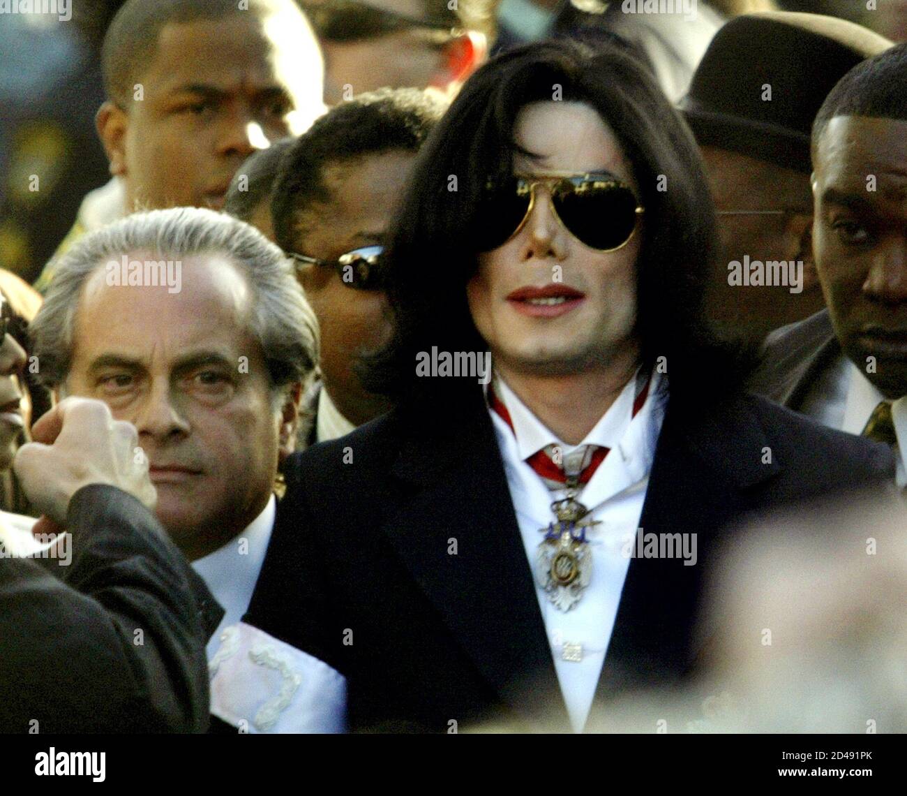 Entertainer Michael Jackson Walks To The Courthouse For His Arraignment In Santa Maria California January 16 04 Hundreds Of Fans From Around The World Sang Songs And Chanted Support As Self Proclaimed King