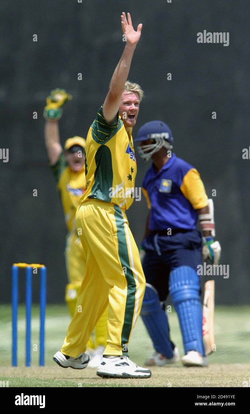 Australian bowler Brad Williams (C) successfully appeals for the dismissal of Sri Lanka Cricket President's team batsman Bathiya Perera (R) in their one-day match at a Colombo suburb of Moratuwa, February 17, 2004. REUTERS/Anuruddha Lokuhapuarachchi  AL Stock Photo