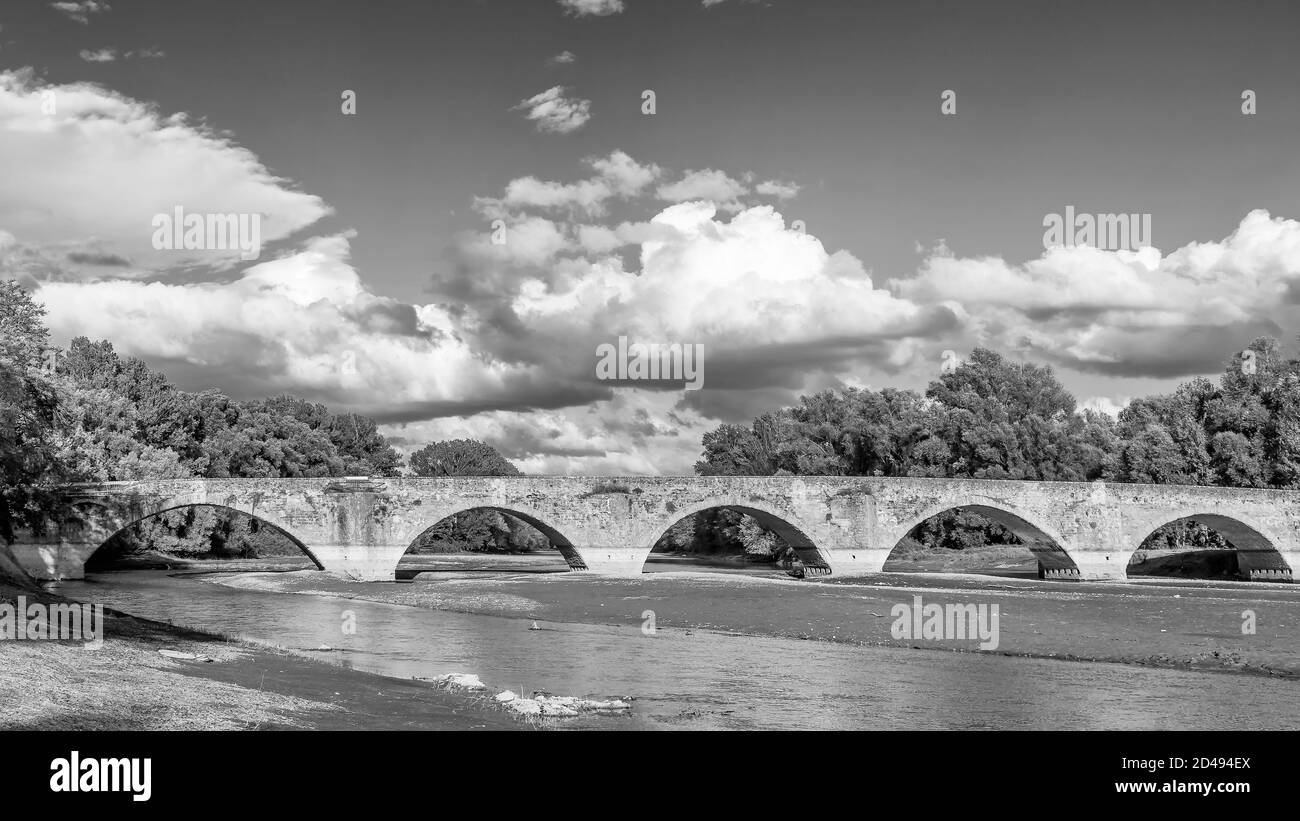 Black and white view of the ancient Ponte Buriano over the Arno river in the province of Arezzo, Tuscany, Italy Stock Photo