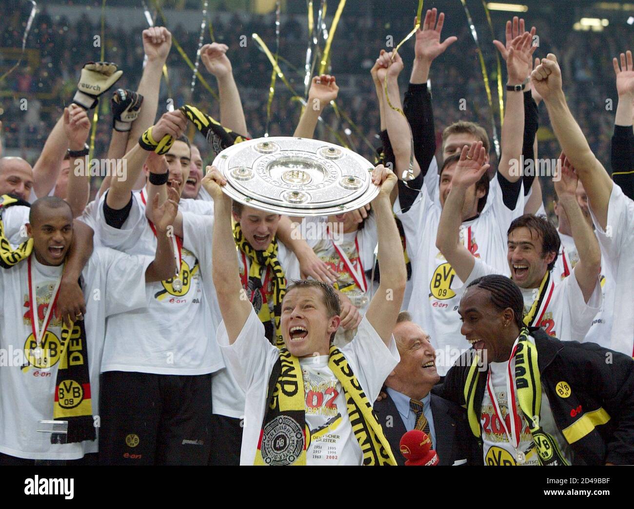 Stefan Reuter, captain of Borussia Dortmund, lifts the German championship  trophy, in front of his team mates in Dortmund's Westfalen stadium, May 4,  2002. Dortmund defeated Werder Bremen 2-1 in the last