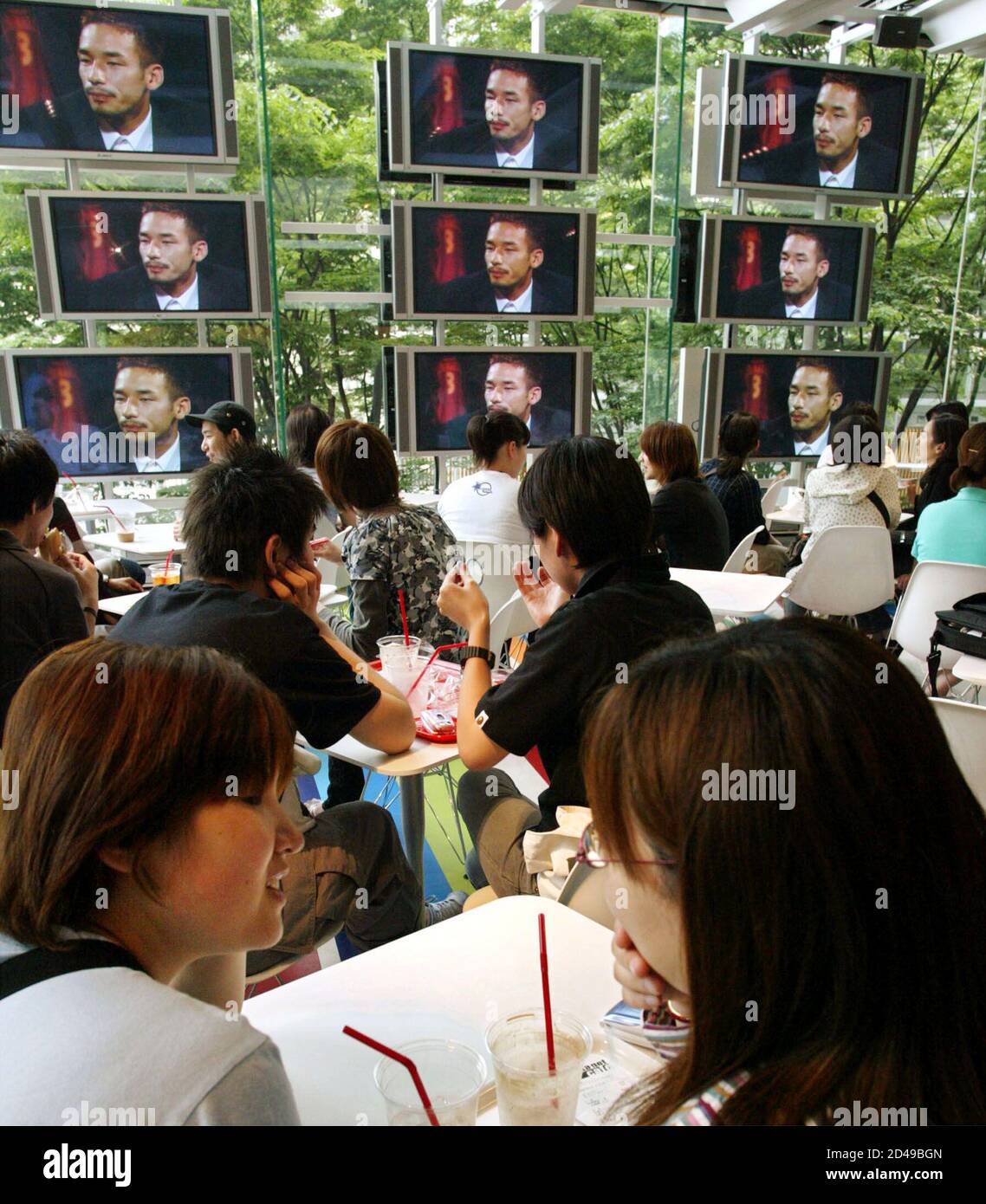 Japanese Soccer Fans Watch A Video Showing Japan S Midfielder Hidetoshi Nakata At The Nakata Net Cafe Run By Nakata In Tokyo May 30 02 The Cafe Offers Information For Soccer Fans From Throughout