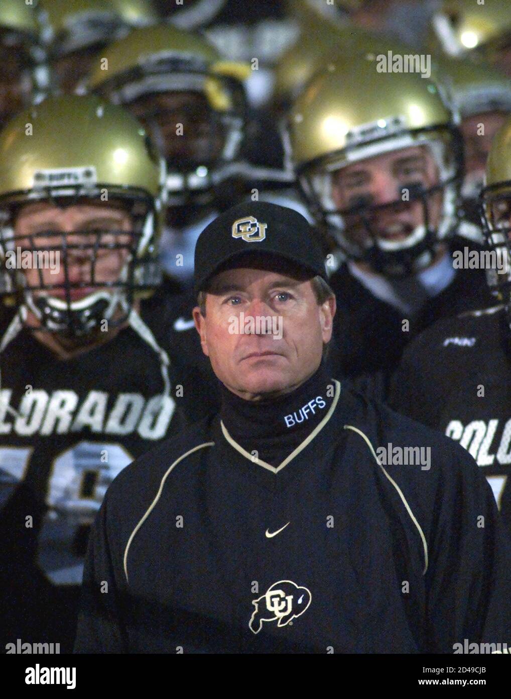 Colorado Buffaloes' head coach Gary Barnett (C) leads his team onto the  field against the Iowa State Cyclones in Boulder, Colorado, November 16,  2002. Barnett will take his Buffaloes to the Big