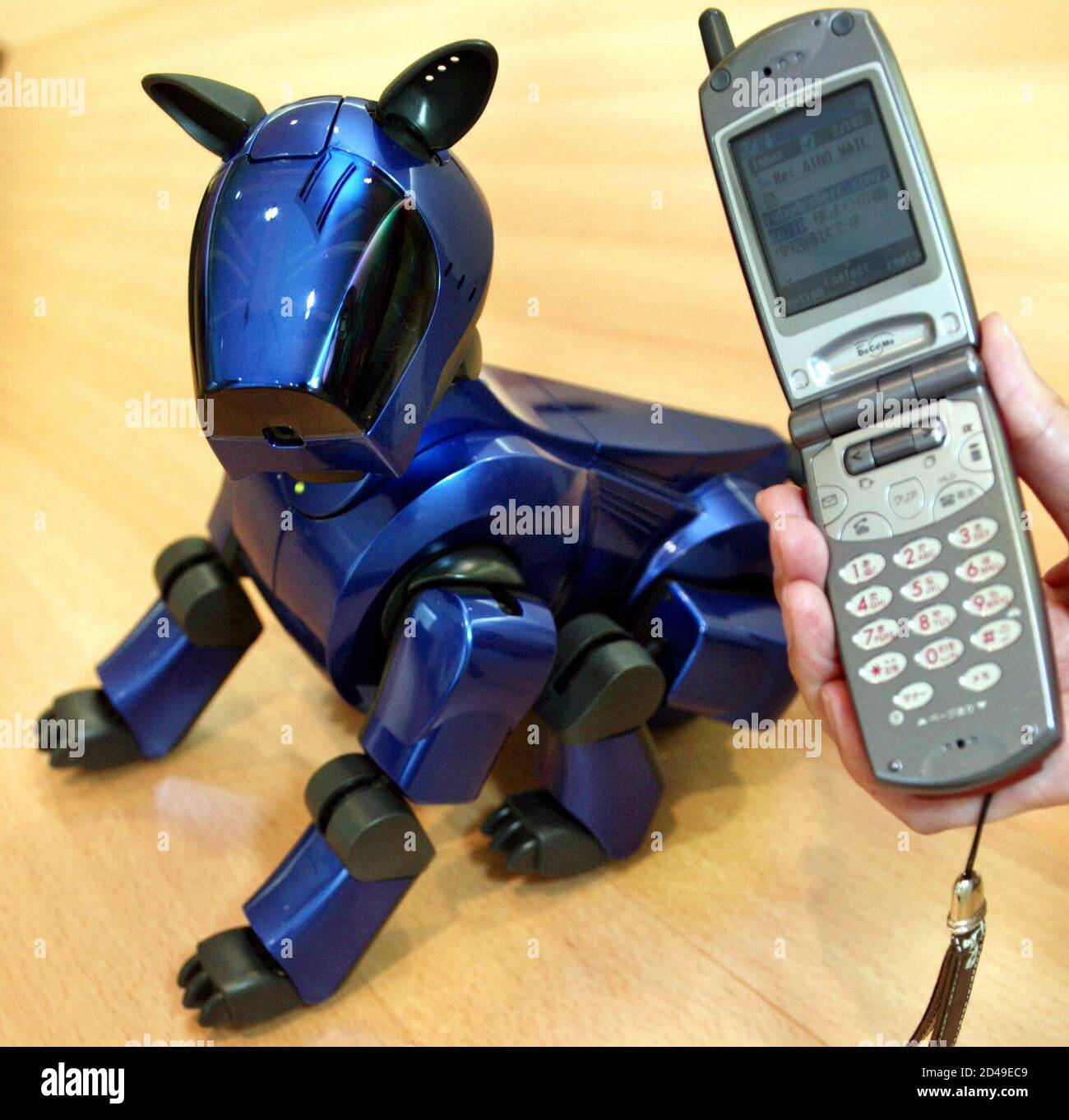 A Cobalt Blue Aibo Cyber Blue Entertainment Robot And The New Software Application Aibo Eyes Which Can Be Used To Control The Four Legged Robot Remotely Via E Mail Commands Are Shown In Tokyo May 21 A Cobalt Blue Aibo Cyber Blue Entertainment Robot And The New Software Application Aibo Eyes Which Can Be Used To Control The Four Legged Robot Remotely Via E Mail Commands Are Shown In Tokyo May 21