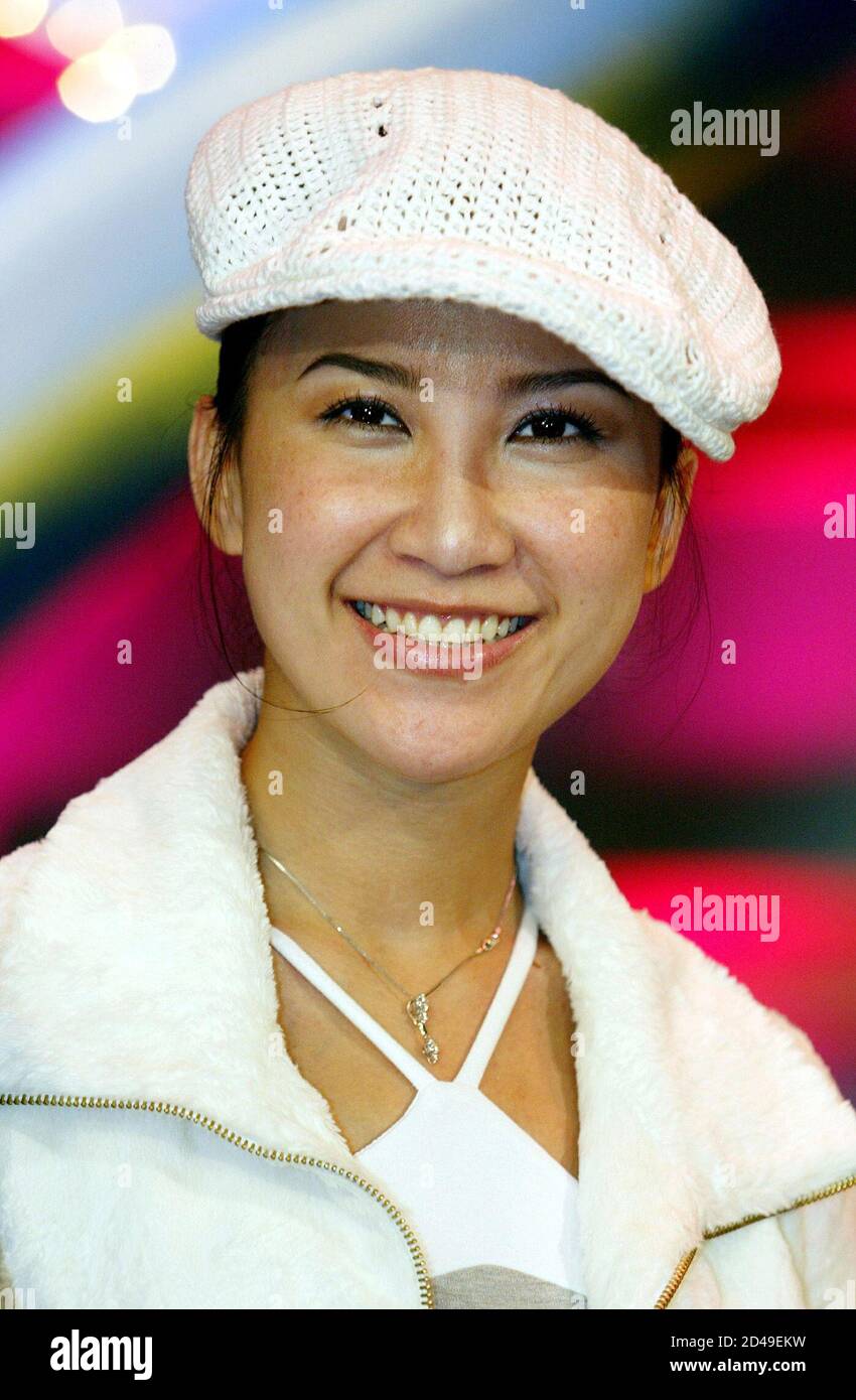 Chinese-American singer Coco Lee poses at a news conference in Hong Kong June 20, 2003. Stock Photo