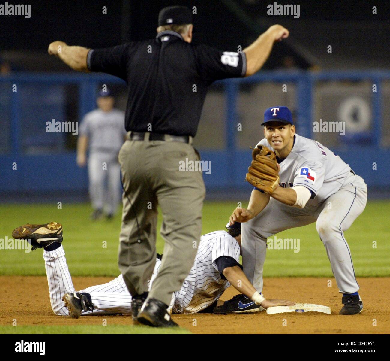 Texas Rangers Shortstop Alex Rodriguez R Looks For The Call From Umpire Larry Young As New York Yankees Runner Aaron Boone L Is Safe On A Pickoff Attempt At Second Base In