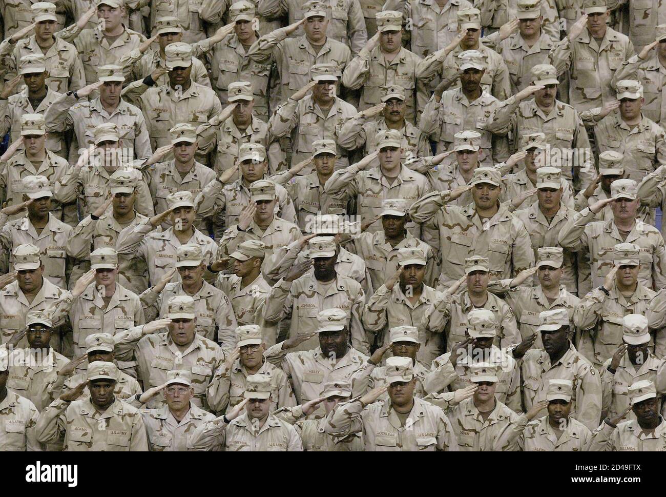 Members Of The 30th Heavy Separate Brigade Of The North Carolina Army National Guard Salute During Playing Of The National Anthem During Their Deployment Ceremony In Fayetteville North Carolina February 12 04