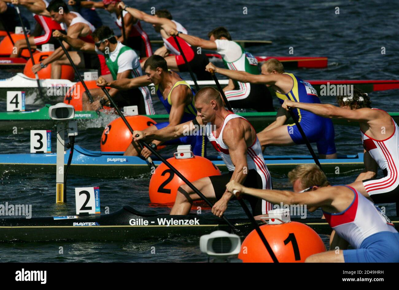 Olympic men canoe team from ( front to back ) U.S., Germany, Ukraine, Hungary, Poland, Canada and Slovakia compete in the heat of the men's C2 canoe flatwater race during the Athens 2004 Olympic Summer Games August 24, 2004. Stock Photo