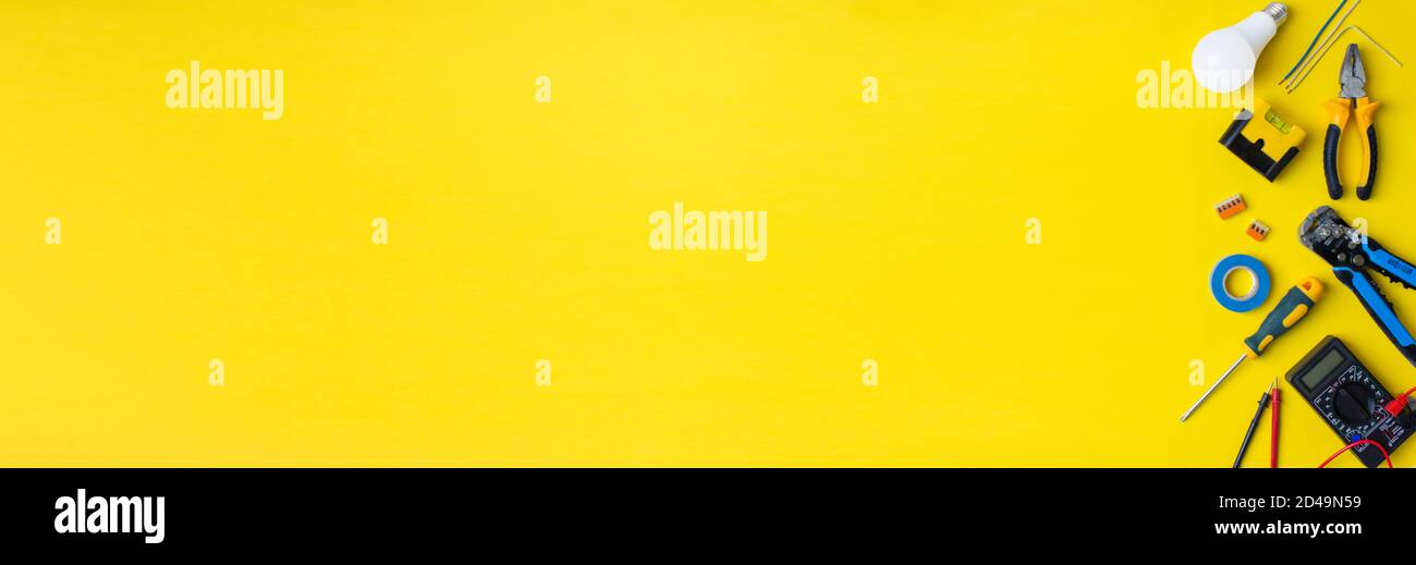 Electriciantools on a yellow background. Banner with space for text Stock Photo
