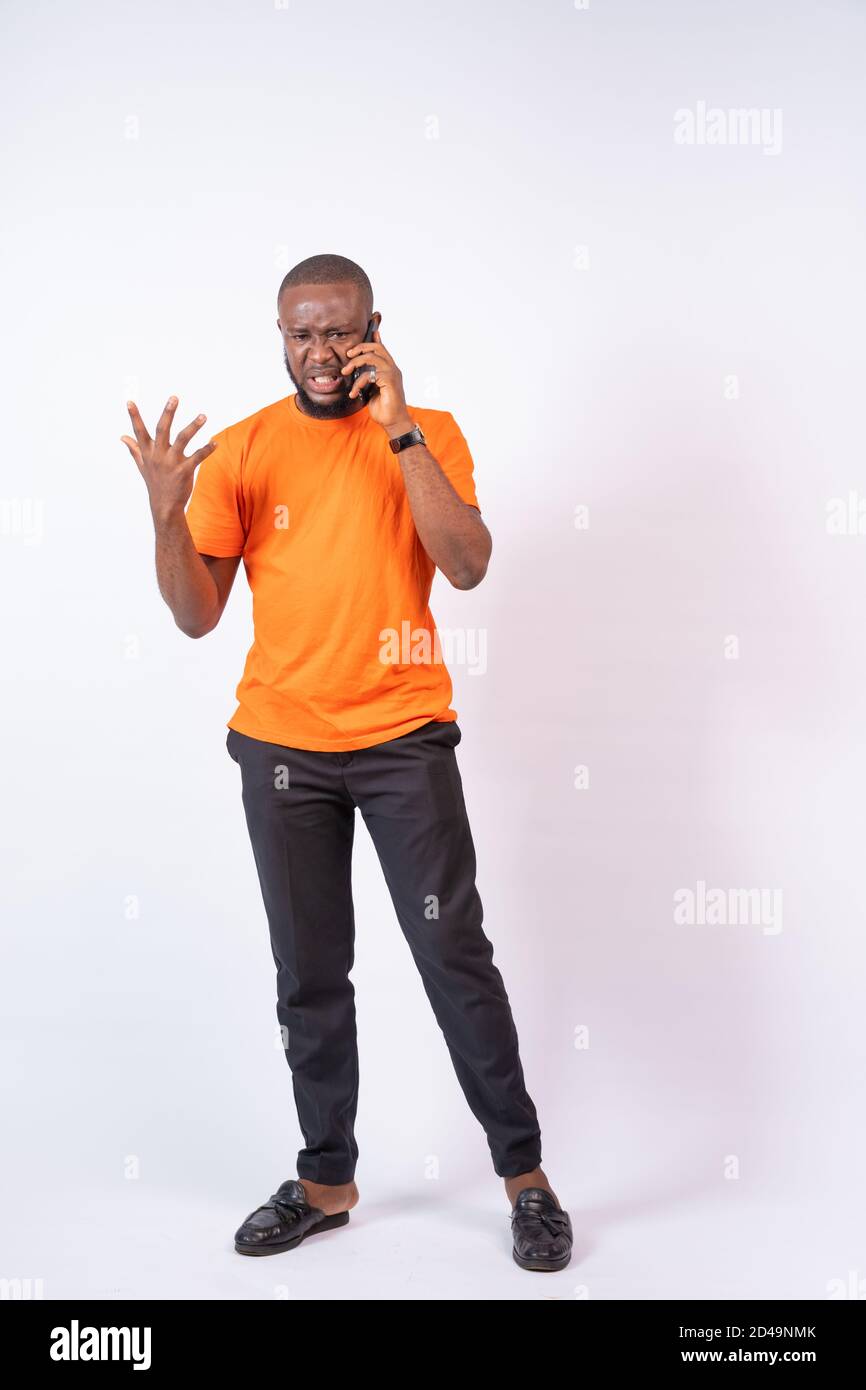 young african making making a phone call quarreling on the phone Stock Photo