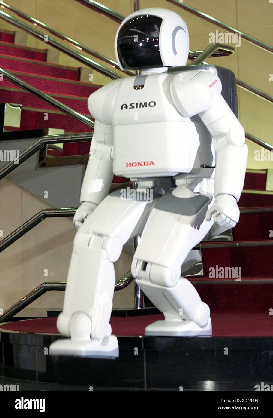 Honda Motor S Human Robot Asimo Descends A Stairway During A Demonstration At Honda Headquarters In Tokyo November 12 01 Honda Has Refined Its 1 2 Metre Four Foot Asimo To Gracefully Walk Down Stairs