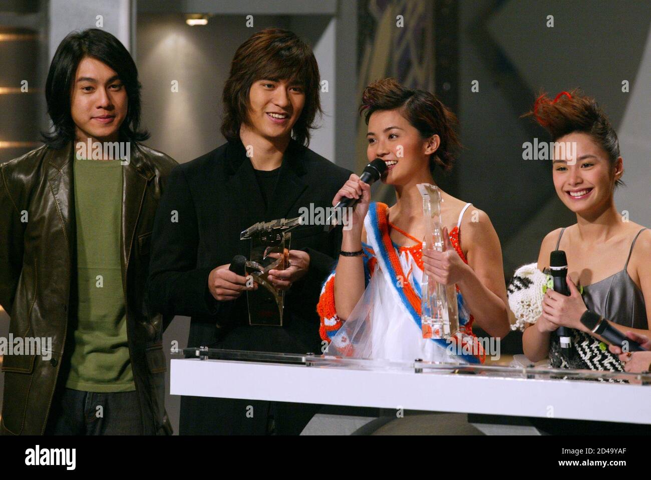 (From L) Hong Kong singer Ken Zhu, Vic Zhou, Charlene Choi and Gillian Chung attend at the music presentation of the Jade Solid Gold Best 10 Awards for year 2002 in Hong Kong January 5, 2003. REUTERS/Kin Cheung REUTERS  KC Stock Photo