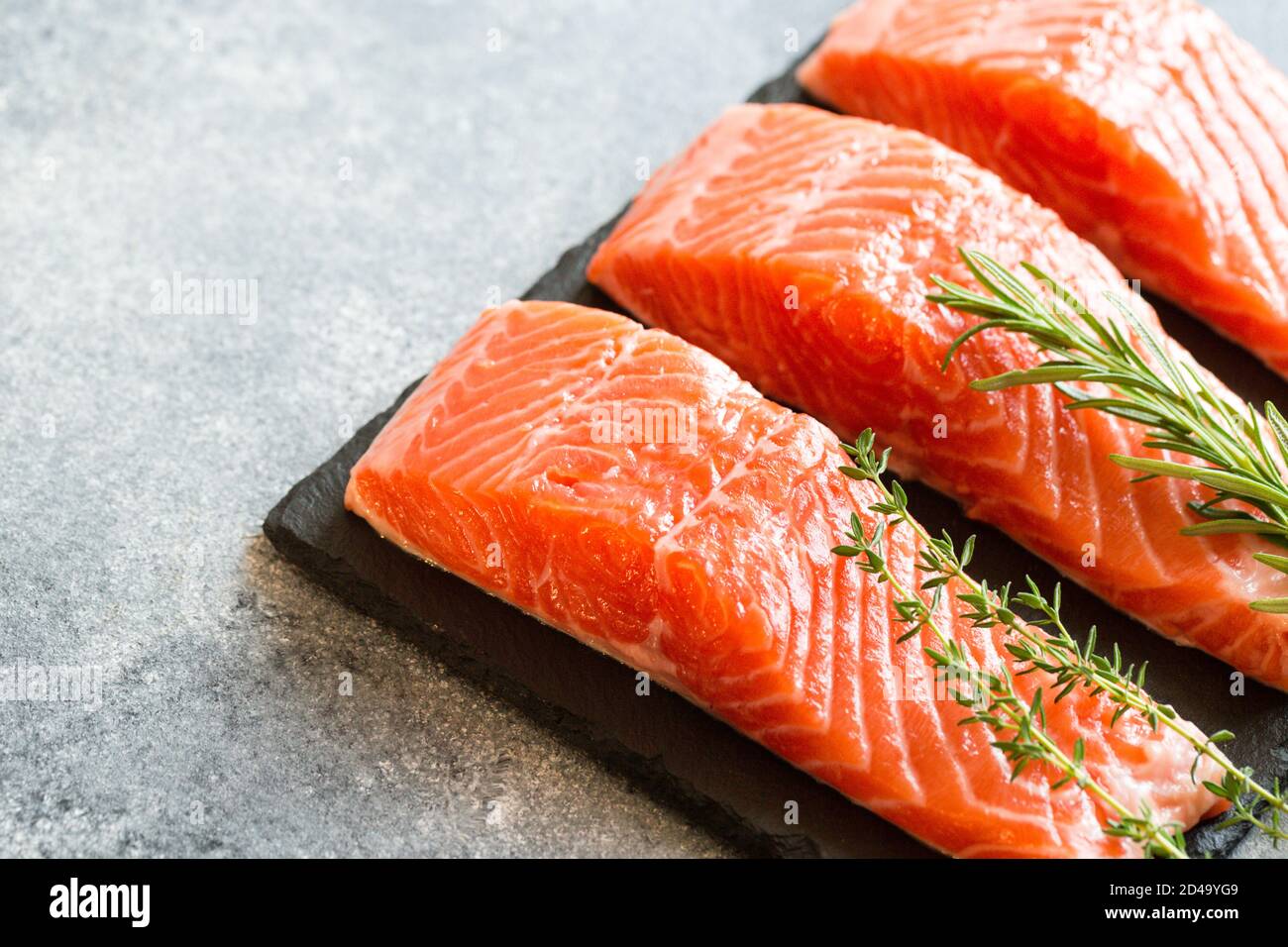 Salmon. Fresh raw salmon fish fillet with cooking ingredients, herbs ...