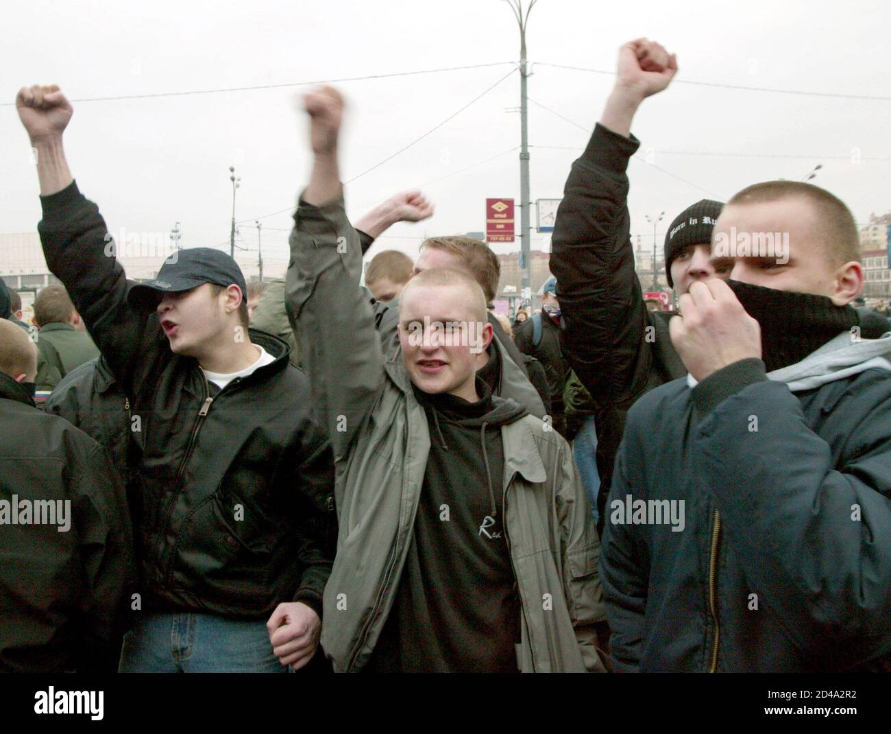Russian youths shout slogans and wave fists as they picket in central Moscow, March 16, 2004. About a hundred picketers gathered in central Moscow on Tuesday to protest against what they called 'illegal immigration'. REUTERS/Sergei Karpukhin  cvi/JV Stock Photo