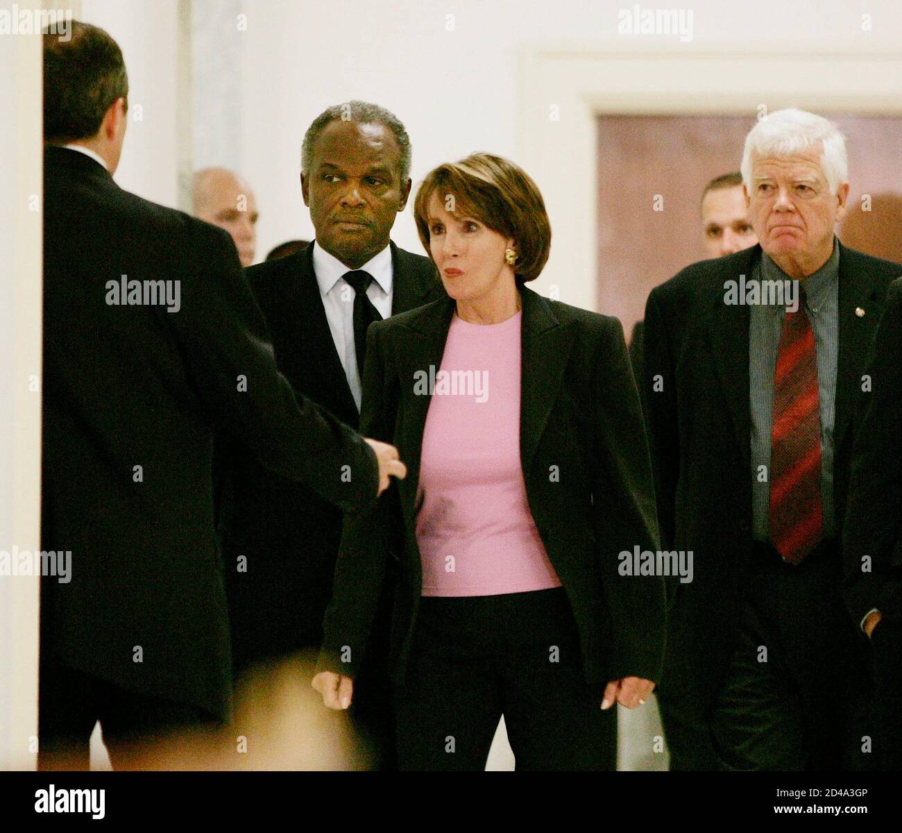 U.S. House Minority Leader Nancy Pelosi (D-CA) leads a group of congressmen into the House Committee on Armed Services room to view unreleased photographs on the abuse of Iraqi prisoners at the Abu Ghraib prison in Iraq by U.S. military personnel, May 12, 2004. REUTERS/Larry Downing  LSD/SV Stock Photo