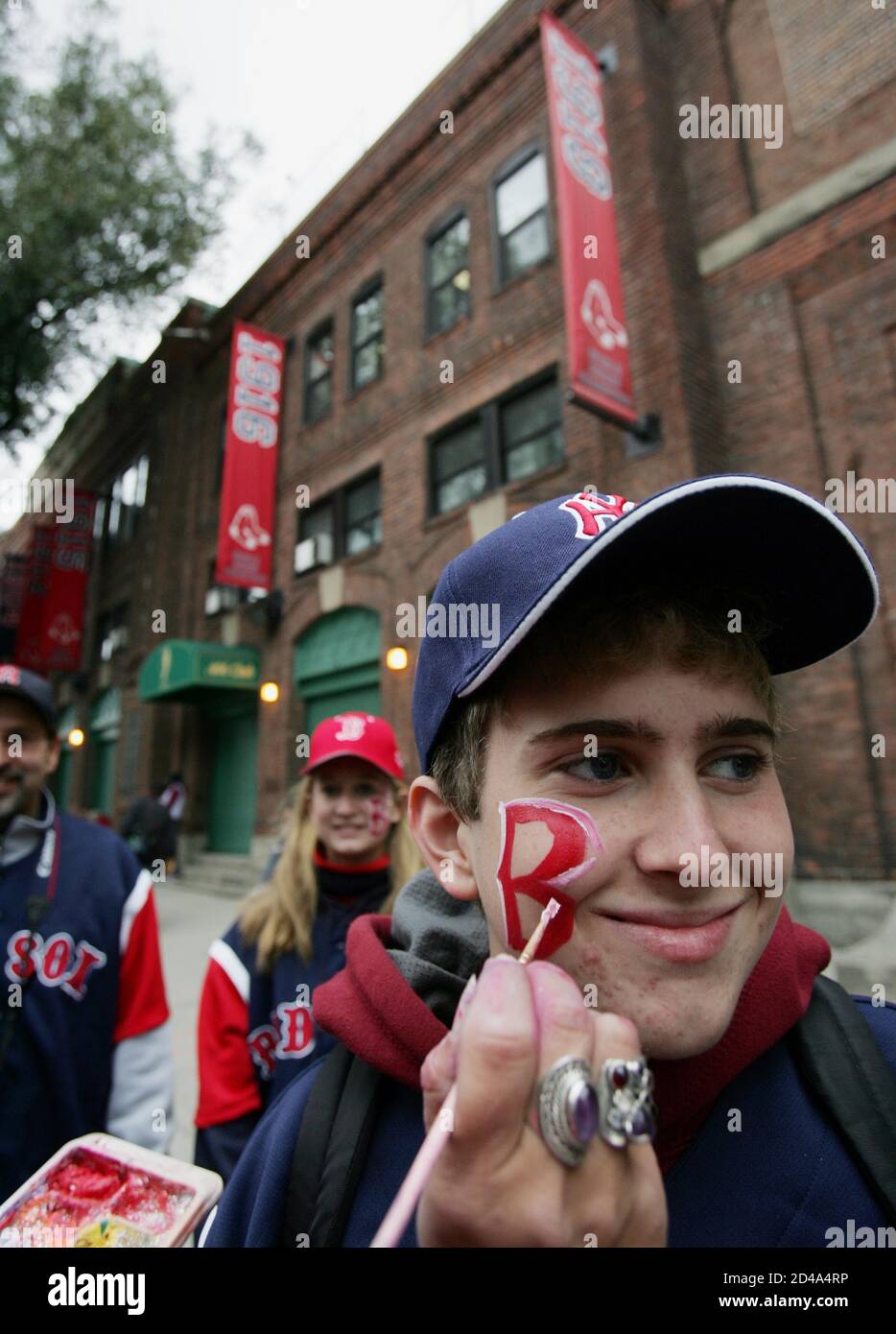 A Boston Red Sox fan has his face painted before Game 1 of the World Series  between the Red Sox and St. Louis Cardinals at Fenway Park in Boston on  October 23,