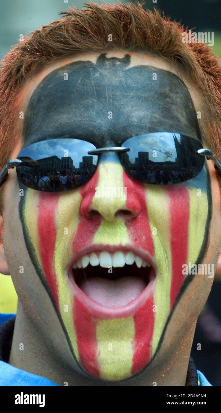 A Valencia Fan Enjoys A Party Atmosphere As He Chants Songs Outside Milan S Famous Duomo May 23 01 The Spanish Team Will Take On The German Champions Bayern Munich Tonight In The
