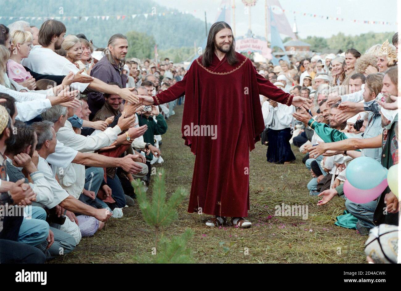 Vissarion, whose original name was Sergei Torop, head of the Vissarion sect  meets his followers during a feast in Petropavlovka village, some 700 kms  southeast of Krasnoyarsk, August 18, 2002. Torop, formerly