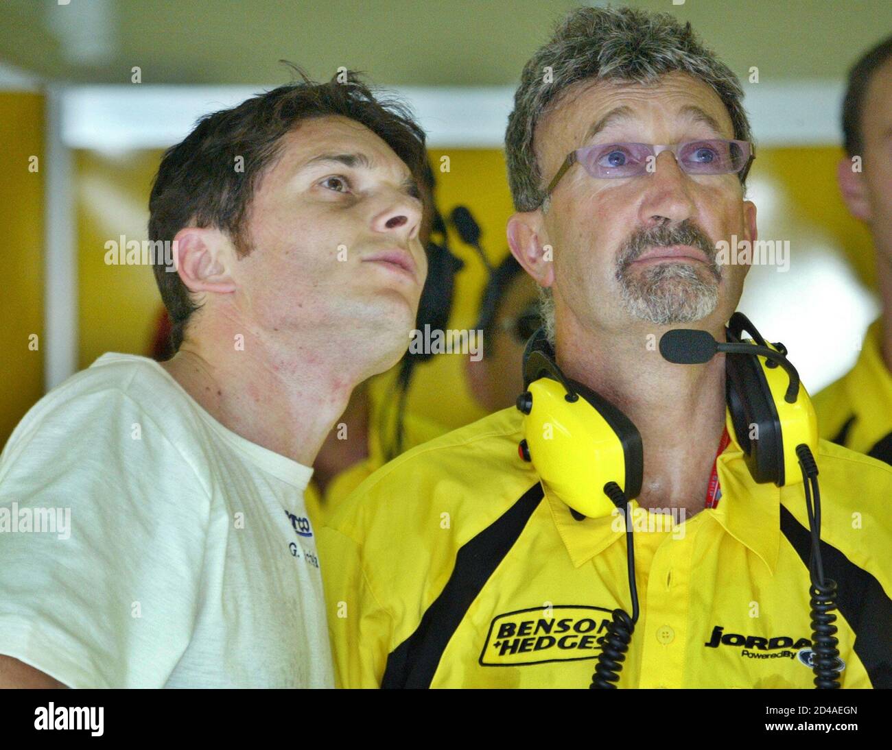 F1 DRIVER FISICHELLA AND HIS TEAM'S CHIEF EXECUTIVE EDDIE JORDAN WATCH MONITOR AT MALAYSIA'S SEPANG Stock Photo -
