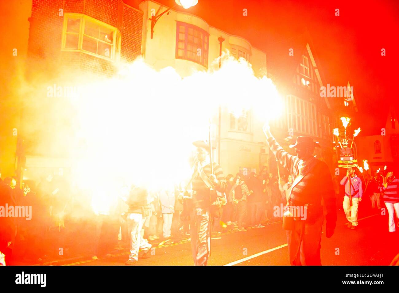 Flaming torches of the street parade Lewes Bonfire celebration in Sussex, UK marking Guy Fawkes night and 17 Protestant martyrs burnt at the stake Stock Photo