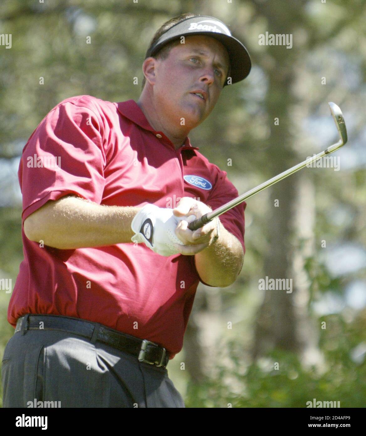Phil Mickelson watches his tee shot from the second hole during the third round of The International in Castle Rock, Colorado, August 9, 2003. The International uses the modified Stableford scoring system. REUTERS/Gary C. Caskey  GCC/GN Stock Photo