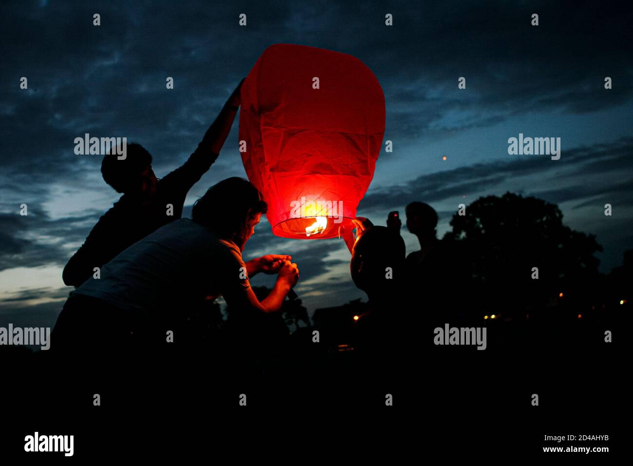 Sky lanterns released into the night sky in a commemorative celebration