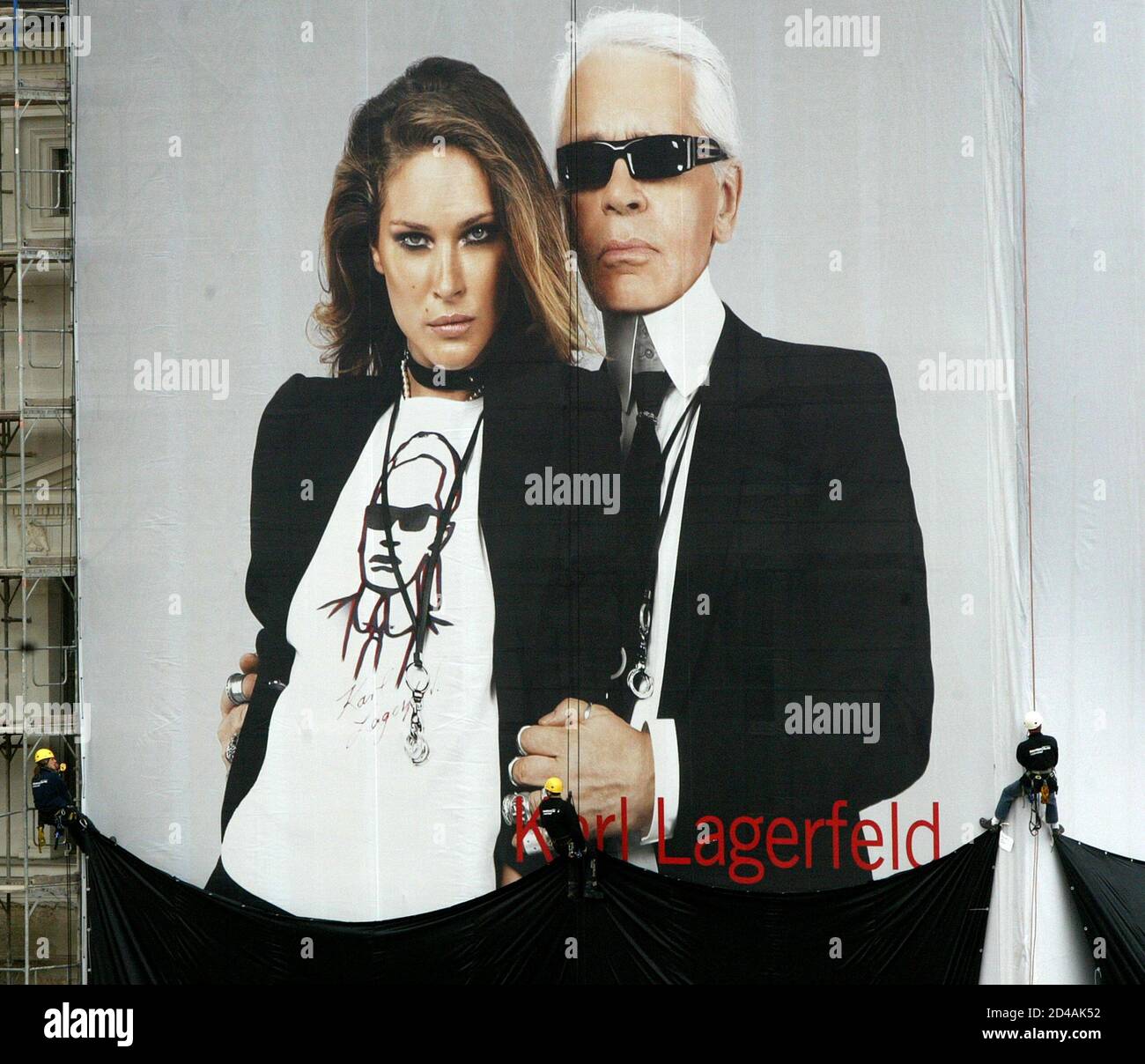 Abseiling workers unveil a giant 1,500 square metre advertisement for  Swedish fashion retailer H&M showing German-born fashion designer Karl  Lagerfeld and U.S. model Erin Wasson on the Unter den Linden boulevard in