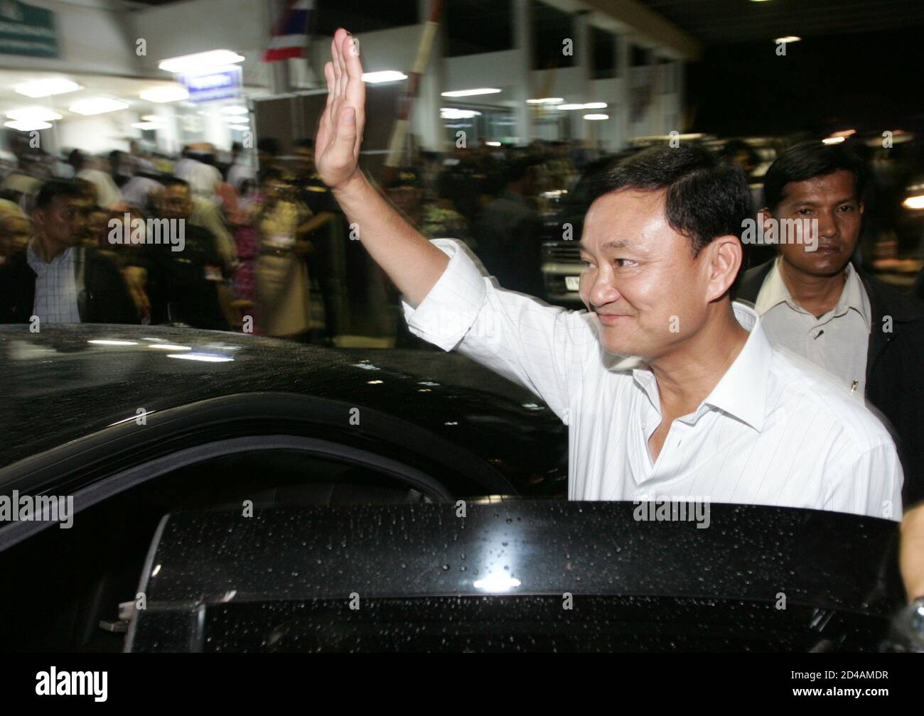 Thai Prime Minister Thaksin Shinawatra waves to residents of Yala province, 1,200 km (750 miles) south of Bangkok, on February 16, 2005. Thaksin arrived in the largely Muslim south on Wednesday with a stern message for villagers tempted to help separatist militants. REUTERS/Sukree Sukplang  SS/SA Stock Photo
