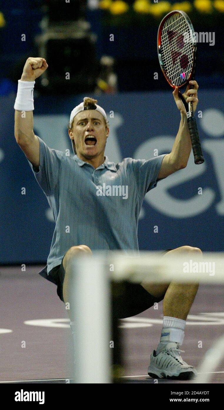 World number one Lleyton Hewitt of Australia celebrates after beating Juan  Carlos Ferrero of Spain during the final of the Tennis Masters Cup in  Shanghai, China November 17, 2002. Hewitt won 7-5