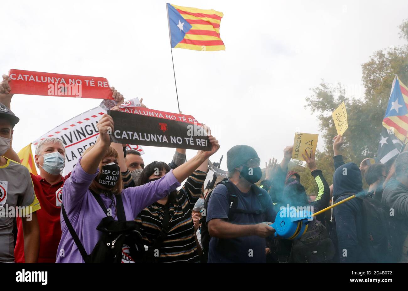 Demonstrators hold placards reading no king" during a protest against Spain's King Felipe and Prime Minister Pedro Sanchez visit to Barcelona to attend a first edition of New Economy Week,