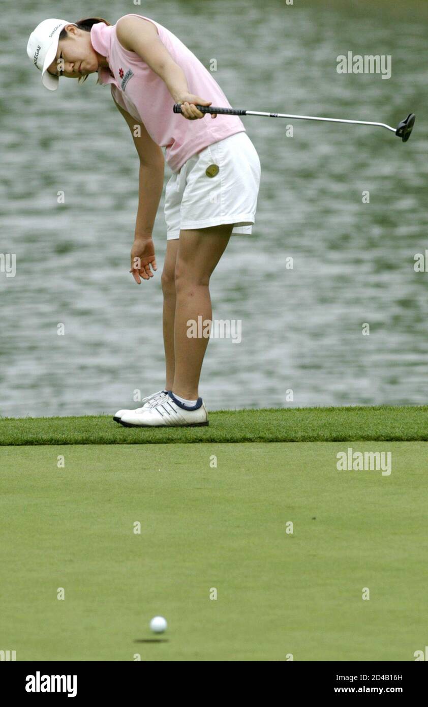 Golfer Young Kim From Choon Cheon South Korea Urges Her Putt On With Her Club On The Third Green During The Fourth Round Of Play At The Asahi Ryokuken International Championship At