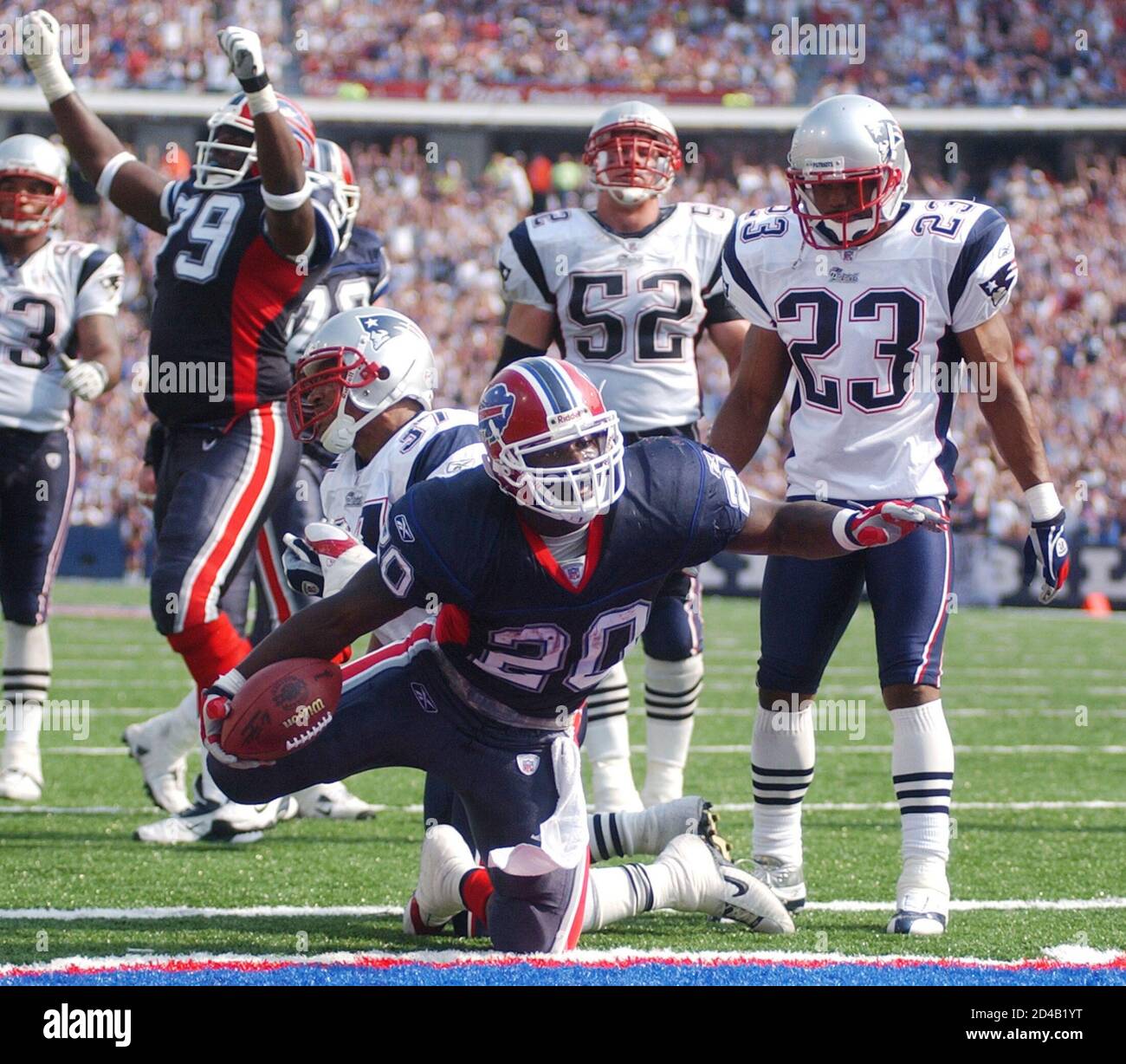 Buffalo Bills running back Travis Henry (20) crosses the end zone his touchdown as New England safety Rodney (37) fails to make the tackle on September 7, 2003 at
