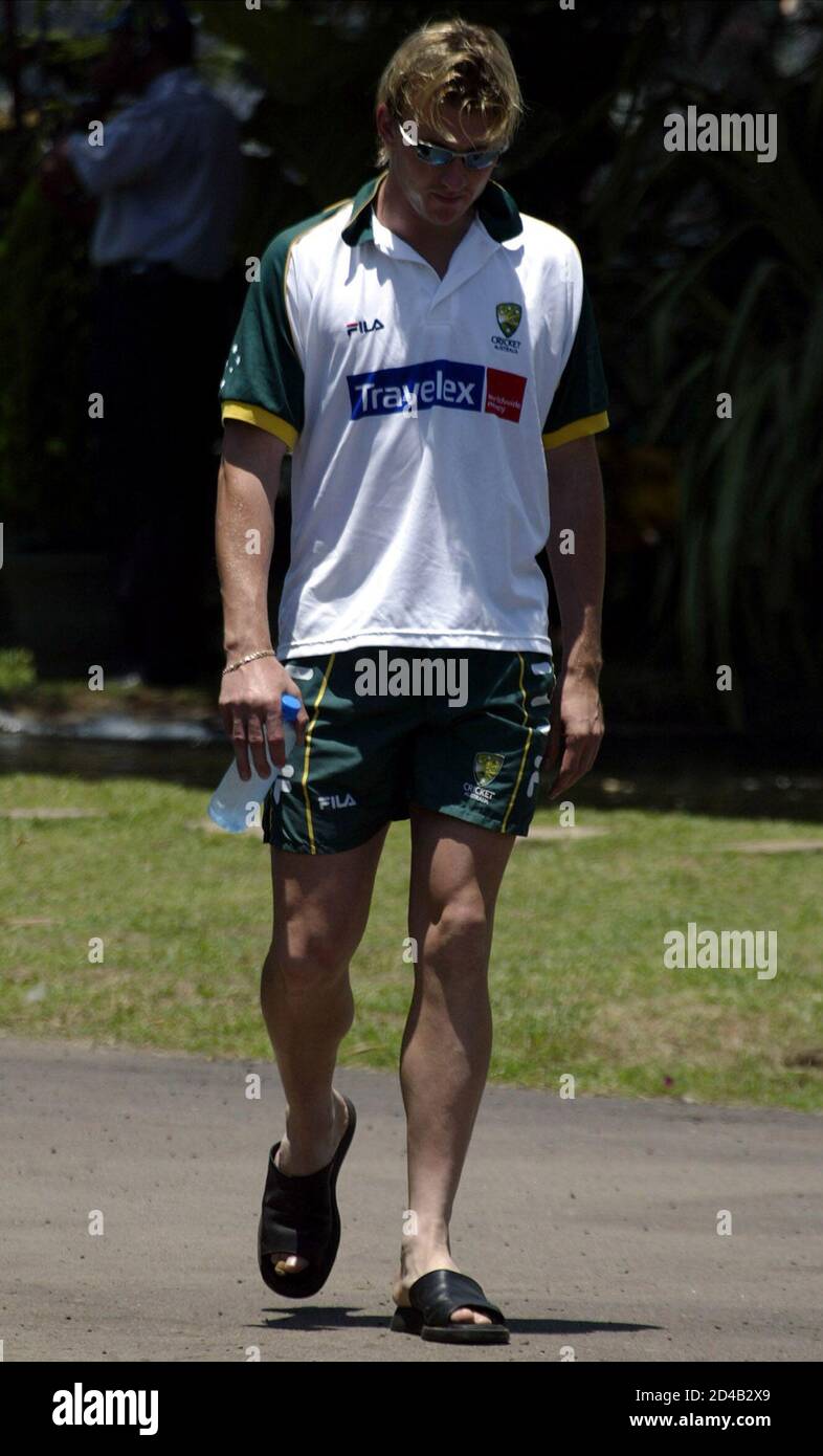 Brett Lee walks to a news conference 
