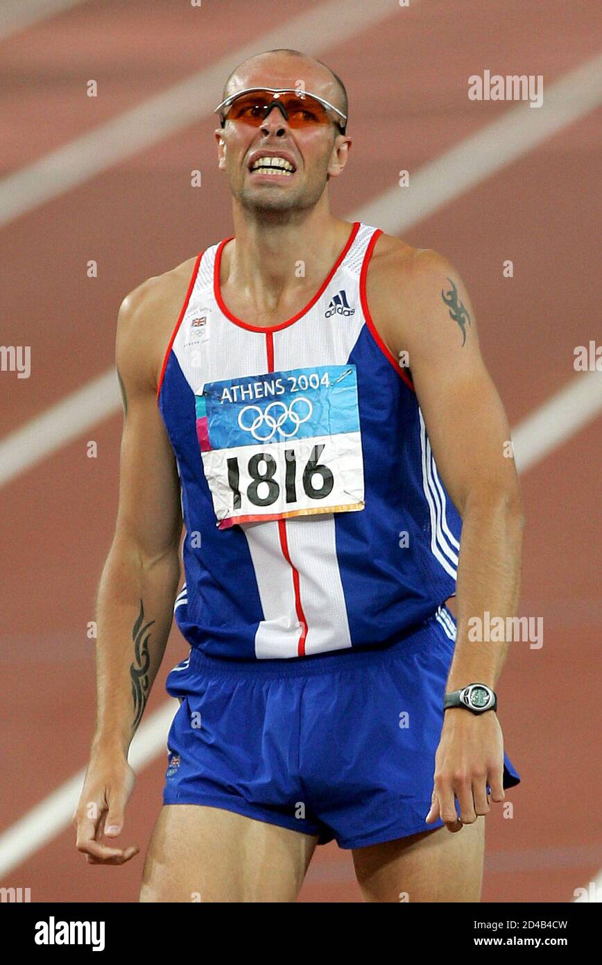 British Decathlete Dean Macey Reacts After Finishing The 1500 Metres In Second Place And Fourth Position Overall In The Men S Decathlon Final At The Olympic Stadium At The Athens 2004 Olympic Summer