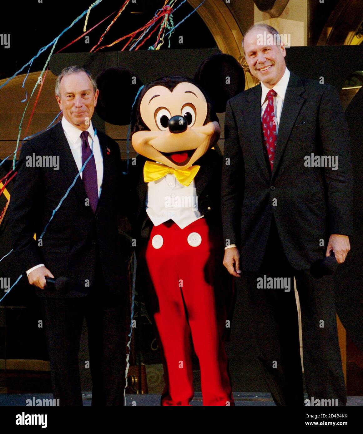 New York City Mayor Michael Bloomberg L Mickey Mouse And Walt Disney Company Chief Executive Michael Eisner Pose For Photos After The Official Opening Of The New World Of Disney Store On