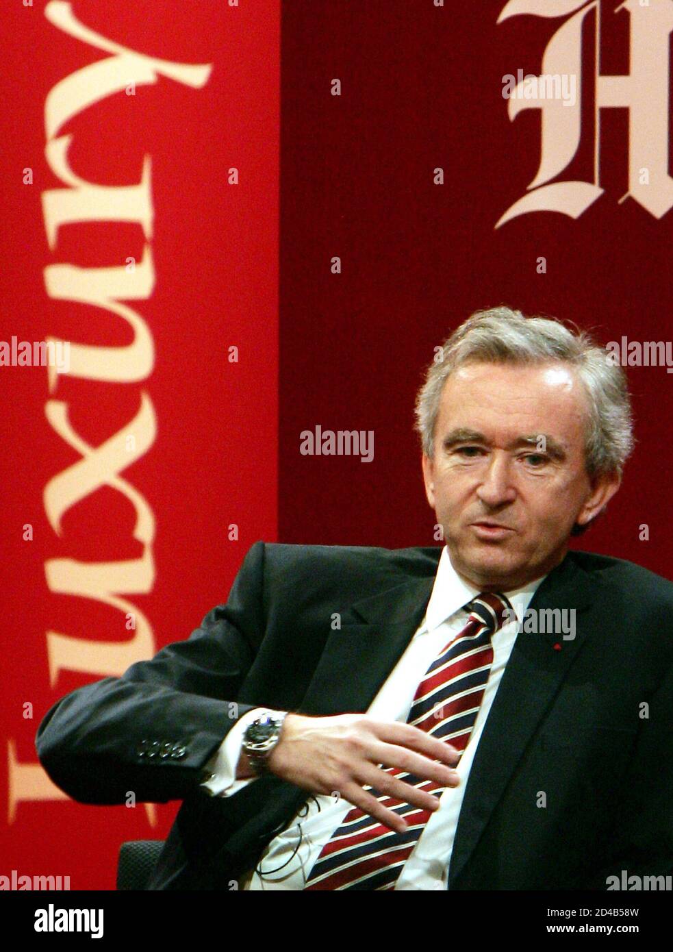 Bernard Arnault, chairman of LVMH Moet Hennessy Louis Vuitton, speaks at the 'Luxury 2004: the Lure of Asia' conference in Hong Kong December 1, 2004. Luxury brands powerhouse LVMH delivered a cautionary note on Wednesday about expecting quick and easy profits from fast-developing China, saying it could take up to a generation for sales to match other key regions. 'It takes time to build a brand. If we go too fast it will be a disaster,' said Bernard Arnault on the sidelines of the luxury goods conference. Stock Photo