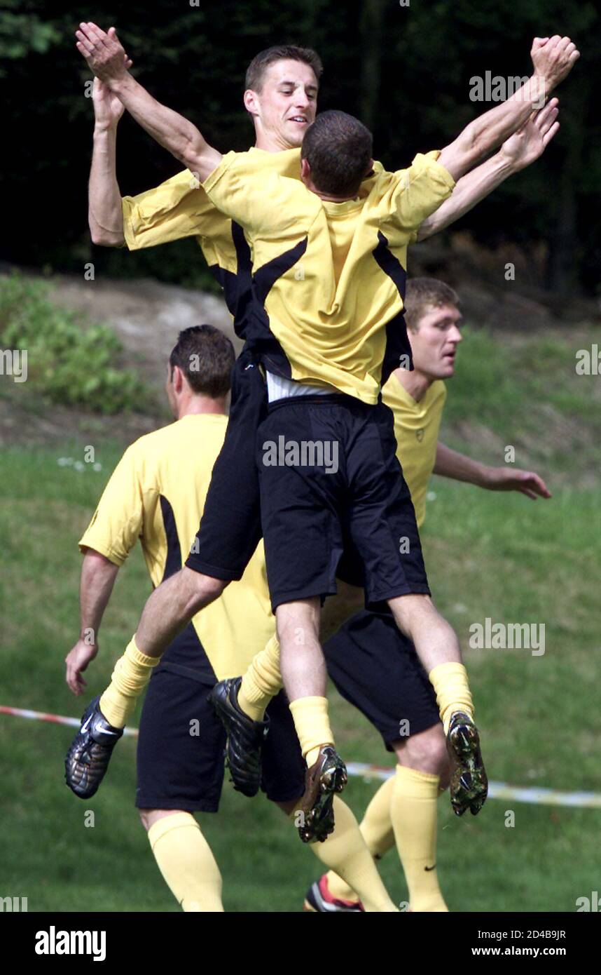 Belgian internationals Timmy Simons (L) of Bruges leaps into the air with Danny Boffin (R) of Sint Truiden during a training session of the Belgian national squad in Kraainem, near Brussels, May 30, 2001. Belgium is preparing for the World Cup 2002 qualifying match against Latvia on June 2 in Brussels.  THR Stock Photo