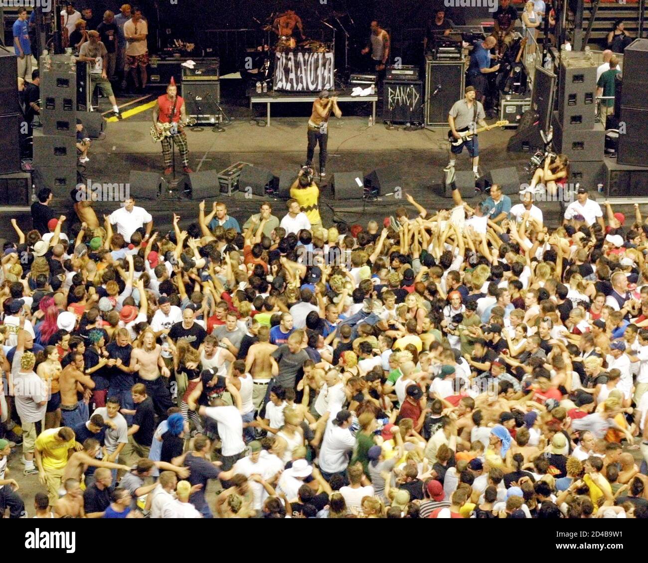 Fans mosh in front of the stage as the punk rock band Rancid performs  during the "