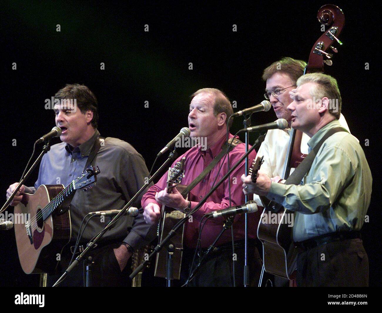 U.S. folk band The Brothers Four, (from left) Mark Pearson, John Paine, Bob Flick and Terry Lauber, performs in Hong Kong November 24, 2001. The Brothers Four has sold over 50 million albums worldwide, said on Tuesday they are glad to record a song that might have a message of love, peace and harmony, and what they are singing has new and fresh meaning after four decades. Stock Photo
