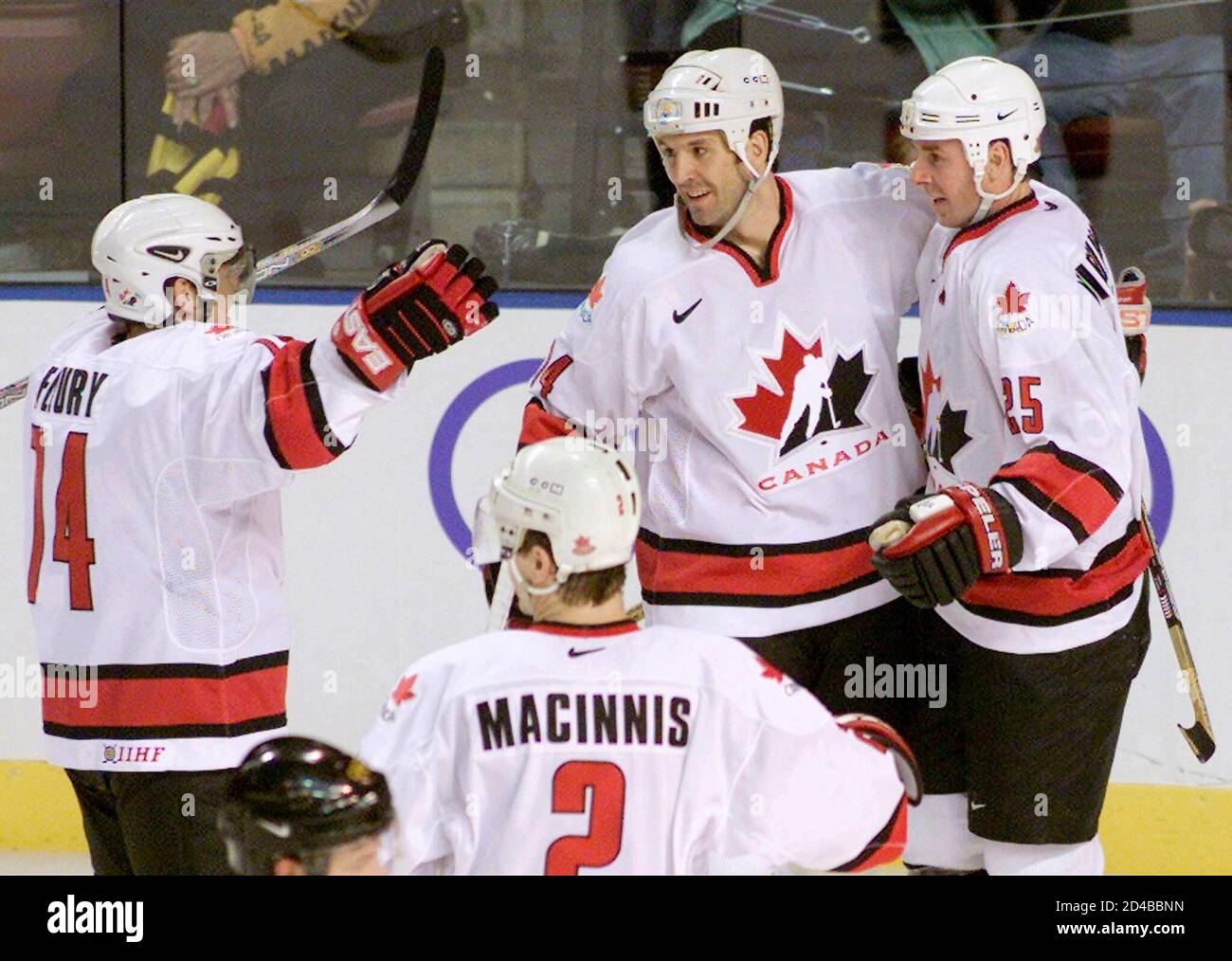 Canadian hockey players (L-R) Theo Fleury, Brendan Shanahan and Joe  Nieuwendyk celebrate Nieuwendyk's game tying goal late in the third period  along with teammate Al Macinnis (2) during their men's final round