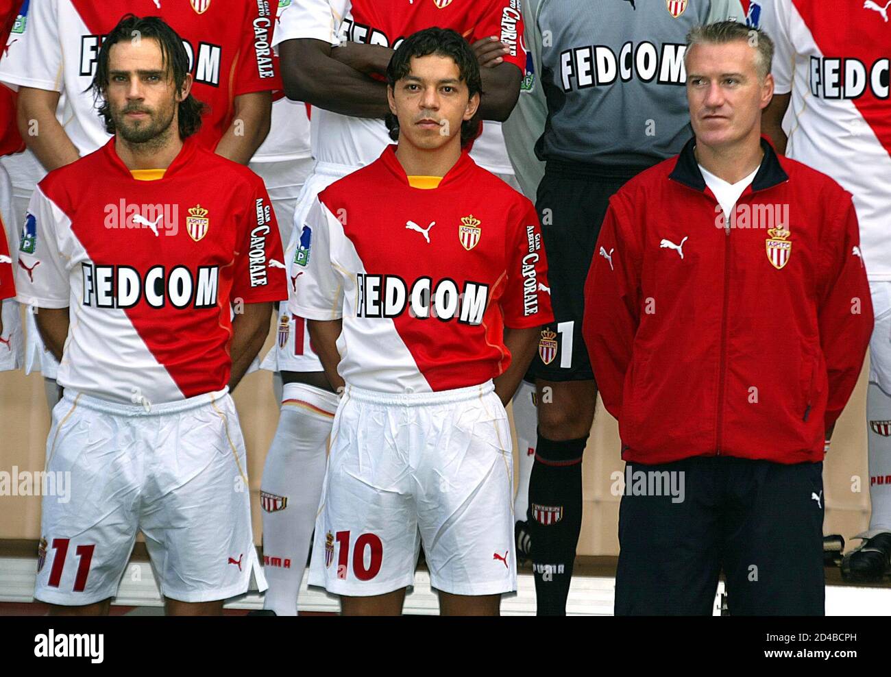 Monaco's soccer team coach Didier Deschamps (R) poses with Marcelo  Gaillardo of Argentina (C) and Marco Simone of Italy (L) during the  official photo session for the 2002-2003 French national league season