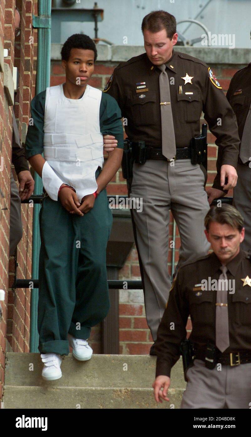 Washington area sniper suspect John Lee Malvo is escorted by Fairfax County  Sheriffs out of Fairfax County juvenile court in Fairfax, Virginia,  November 15, 2002. Malvo was at a hearing to decide