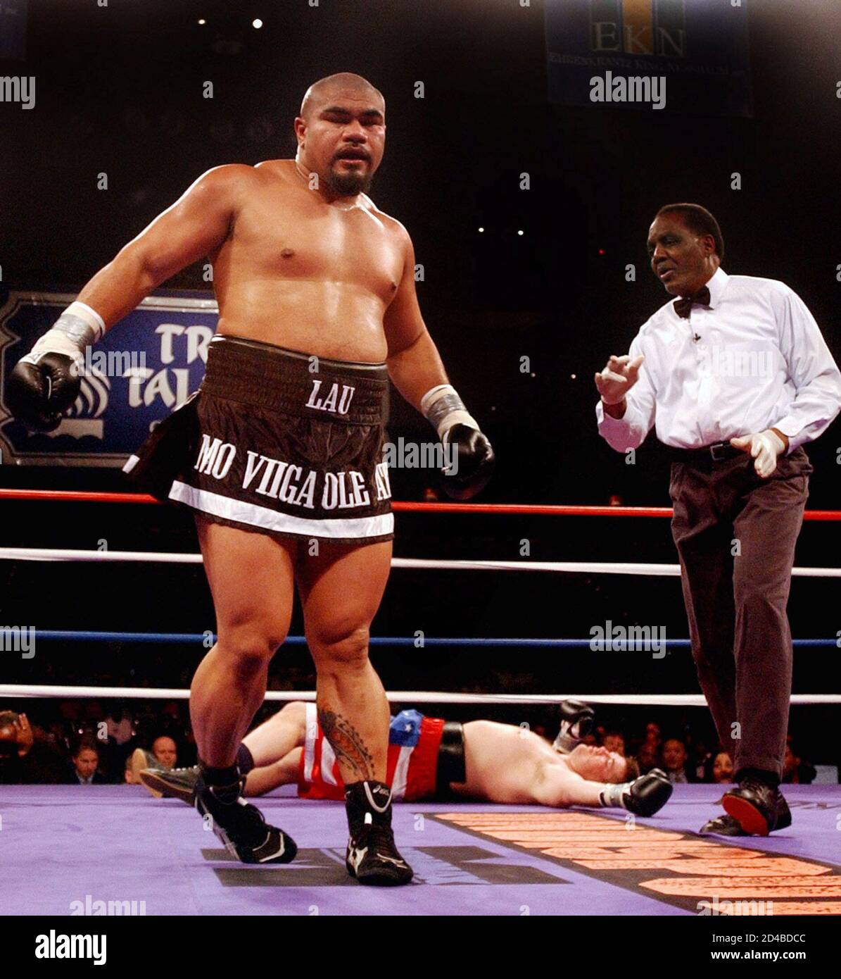 Heavyweight Boxer David Tua From New Zealand L Is Directed To A Neutral Corner By Referee Eddie Johnson R After Knocking Out His Opponent Russell Chasteen On Mat From Louisville Kentucky November Heavyweight Boxer David Tua From New Zealand L Is Directed To A Neutral Corner By Referee Eddie Johnson R After Knocking Out His Opponent Russell Chasteen On Mat From Louisville Kentucky November