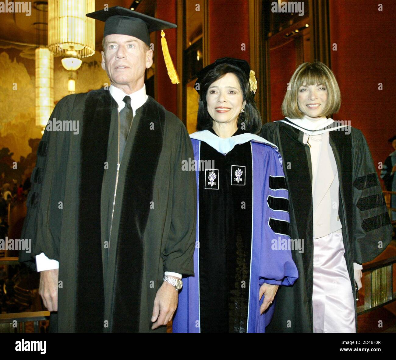 Fashion designer Calvin Klein (L), Fashion Institute of Technology  President Dr. Joyce Brown (C) and Vogue magazine editor in chief Anna  Wintour pose for photos at FIT graduation exercises at Radio City