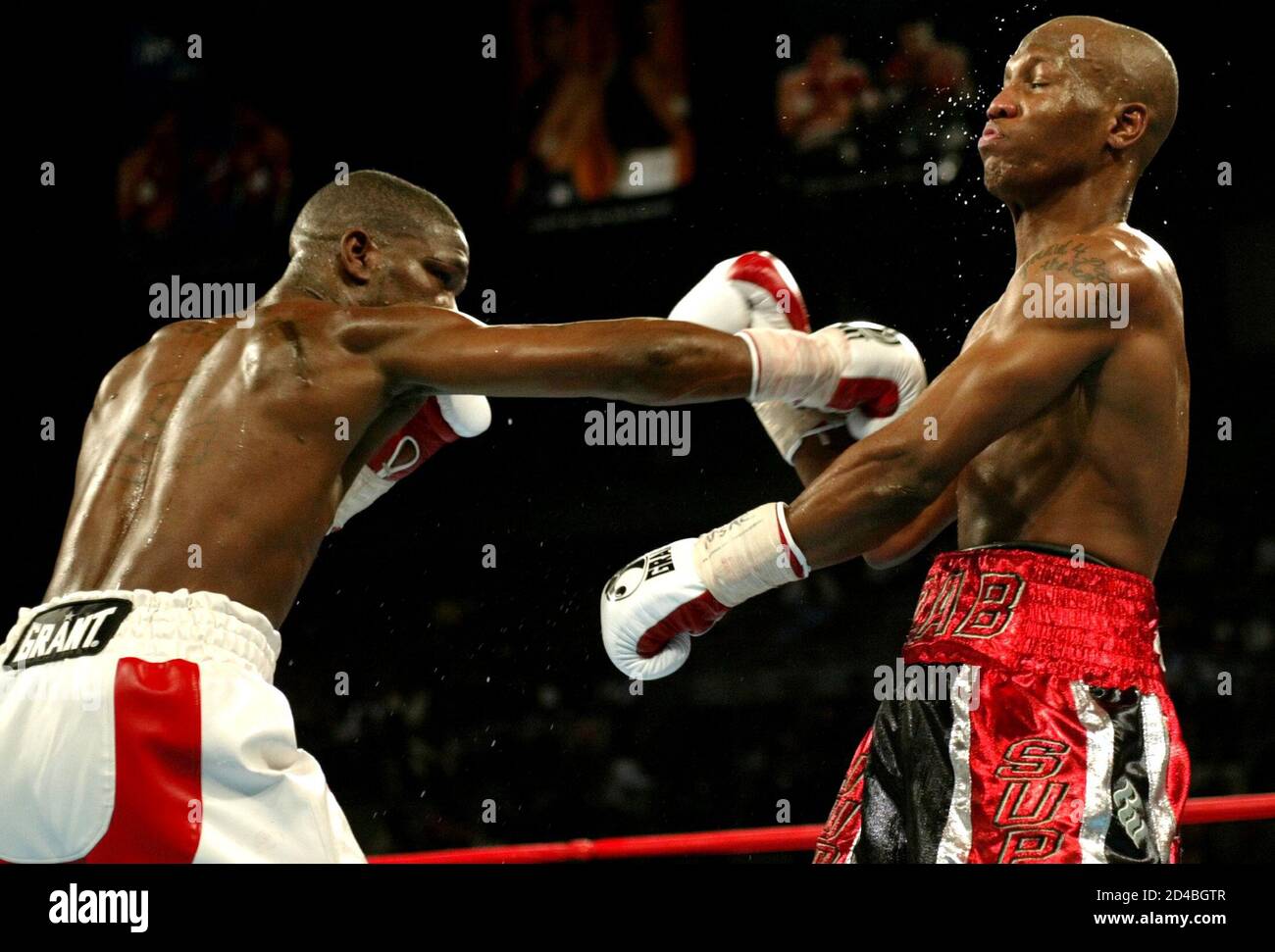 Undisputed welterweight champion Cory Spinks (L) of St. Louis, Missouri connects with a punch on Zab Judah of Brooklyn, New York during the fourth round of their 12-round title fight at the Mandalay Bay Events Center in Las Vegas, Nevada, April 10, 2004. Spinks retained his WBC/WBA/IBF titles by unanimous decision. Stock Photo