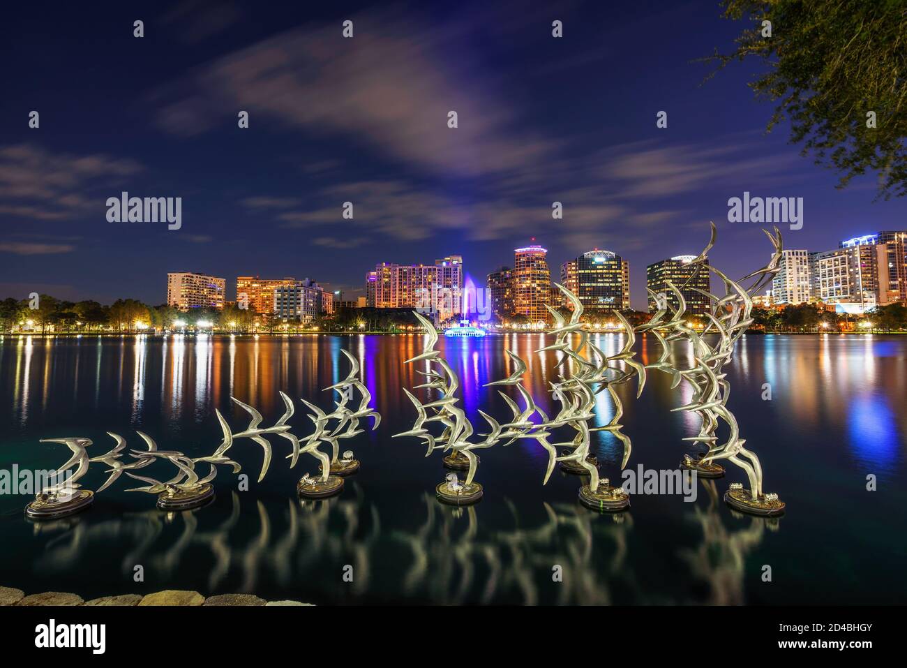 Flying birds sculpture in Lake Eola Park at night in Orlando, Florida Stock Photo