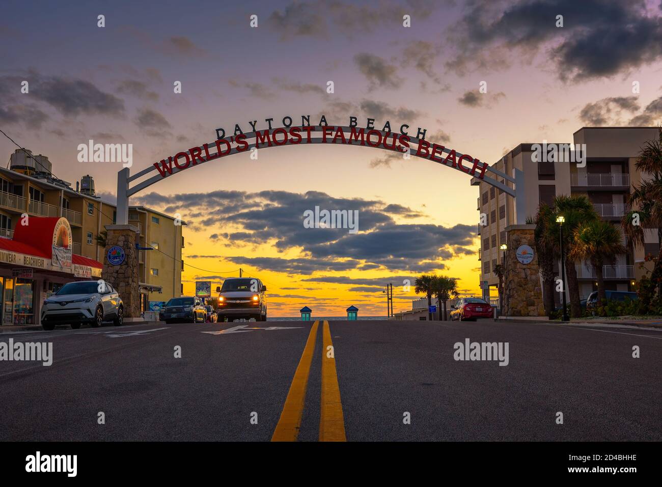 Daytona Beach welcome sign stretched across the street at sunrise Stock Photo