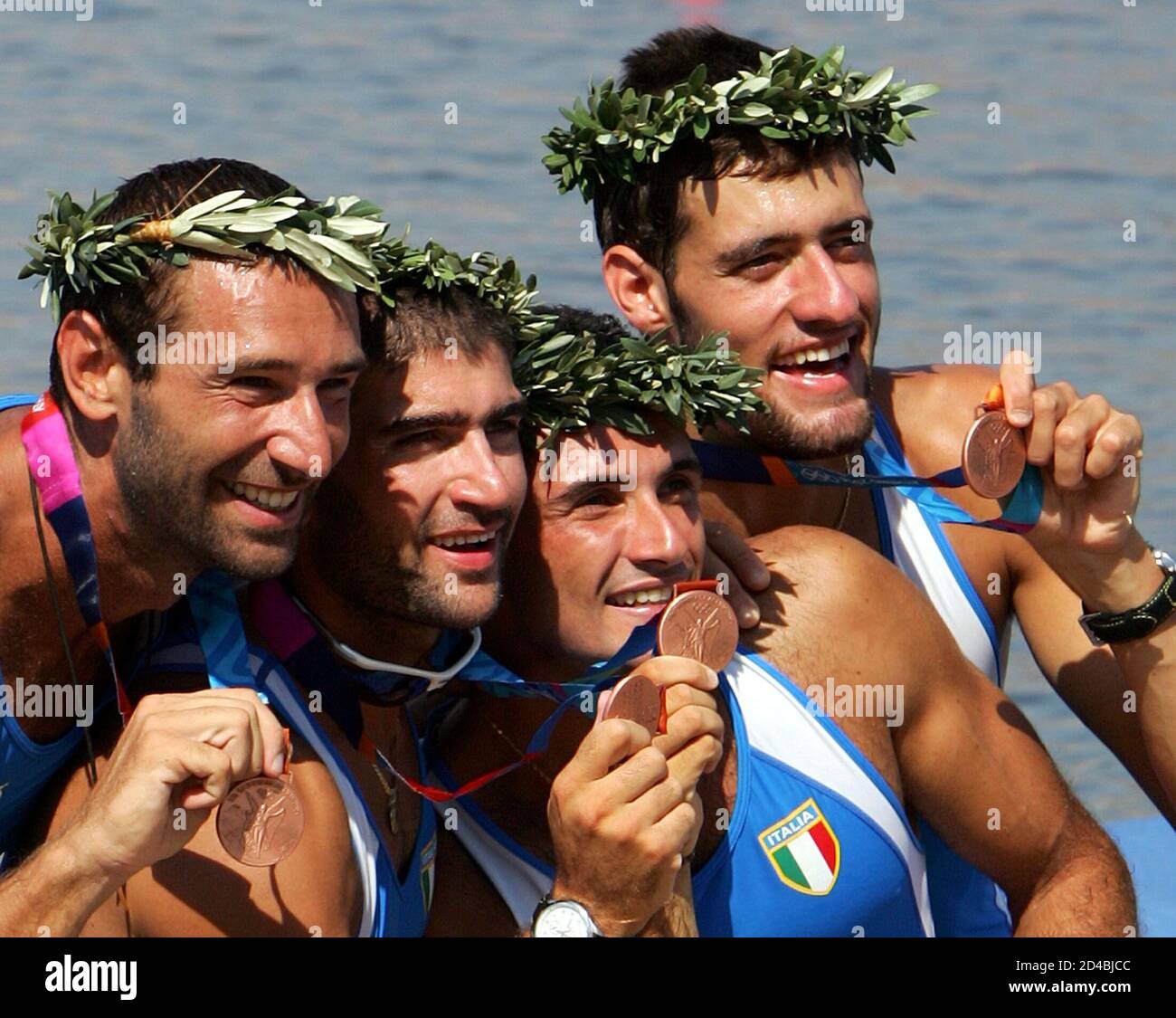 Italy's coxless four bronze medallists, including  Lorenzo Porzio, Dario Dentale, Luca Agamennoni, and Rafaello Leonardo celebrate with their medals during the awards ceremony at the Athens 2004 Olympic Summer Games, August 21, 2004. Stock Photo