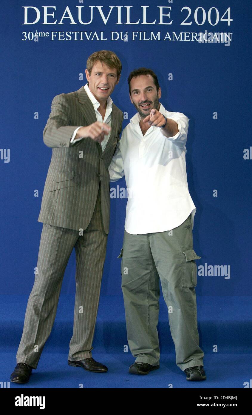 French actor Lambert Wilson (L), poses with French Director Jean-Christophe  Comar (R), known as Pitof, during a photocall for their film "Catwoman", at  the American Film Festival of Deauville September 5, 2004
