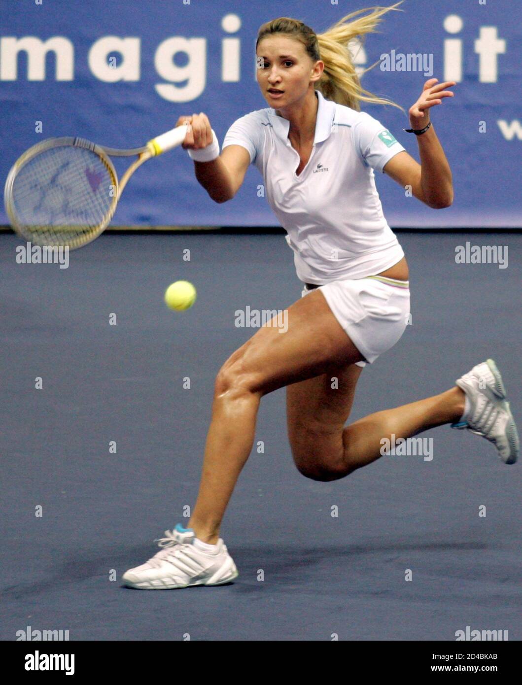 France's Tatiana Golovin returns a ball to Svetlana Kuznetsova of Russia  during the final Fed Cup tennis match in Moscow, November 28, 2004.  Moscow-born Golovin kept alive France's hopes of retaining their
