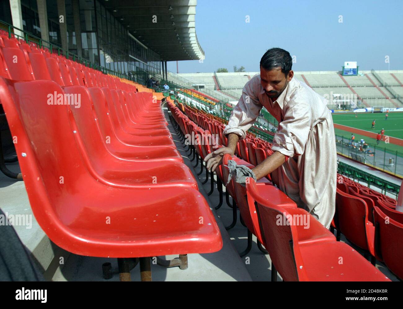 Pakistani workers renovate the National Hockey Stadium for the